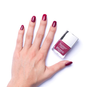 butter LONDON - Broody (Red) Patent Shine 10X Nail Lacquer - Lifestyle Image - Full White Background.