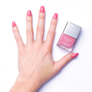 butter LONDON - Coming Up Roses (Rose Pink) Patent Shine 10X Nail Lacquer - Lifestyle Image - Full White Background.