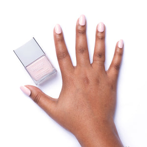 butter LONDON - Piece of Cake (Light Pink) Patent Shine 10X Nail Lacquer - Lifestyle Image - Full White Background.