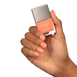 butter LONDON - Hottie Tottie (Orange) Patent Shine 10X Nail Lacquer - Lifestyle Image - Full White Background.
