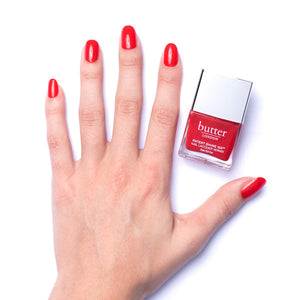 butter LONDON - Smashing (Bright Red) Patent Shine 10X Nail Lacquer - Lifestyle Image - Full White Background.
