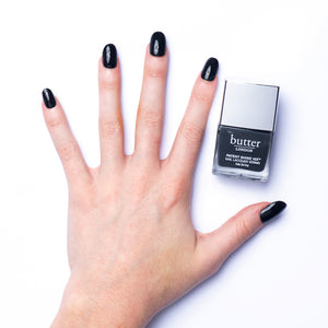 butter LONDON - Earl Grey (Dark Grey) Patent Shine 10X Nail Lacquer - Lifestyle Image - Full White Background.