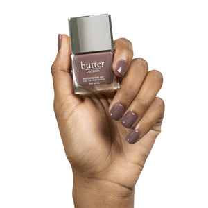 butter LONDON - Royal Appointment (Brown) Patent Shine 10X Nail Lacquer - Lifestyle Image - Full White Background.