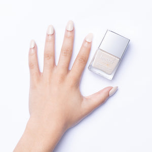 butter LONDON - Steady On (Off White) Patent Shine 10X Nail Lacquer - Lifestyle Image - Full White Background.
