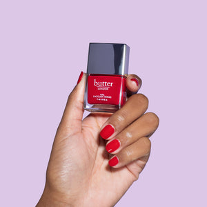 butter LONDON - Come to Bed Red (Bright Red) Patent Shine 10X Nail Lacquer - Lifestyle Image - Full White Background.